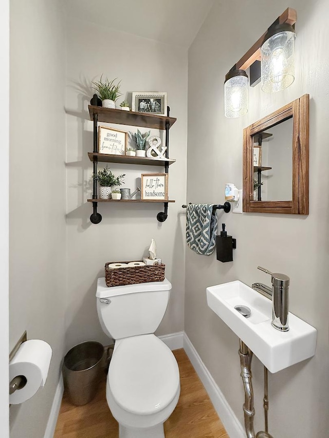 1402 W Lincoln Blvd, Freeport, IL 61032 - half bathroom featuring wood finished floors