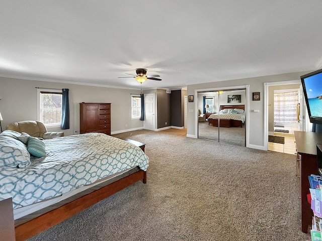 1402 W Lincoln Blvd, Freeport, IL 61032 - carpeted bedroom with two closets, a ceiling fan, crown molding, and ensuite bath
