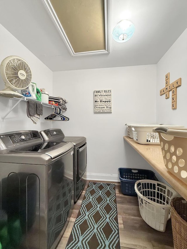 1402 W Lincoln Blvd, Freeport, IL 61032 - laundry area with washer and clothes dryer, wood finished floors, and attic access