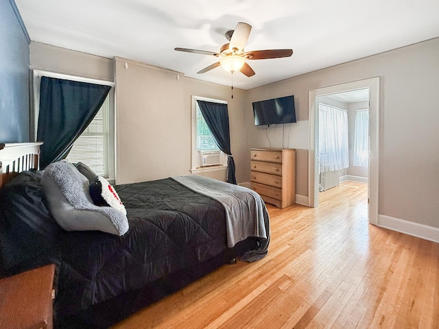 1402 W Lincoln Blvd, Freeport, IL 61032 - bedroom with light wood-style floors, ceiling fan, and cooling unit