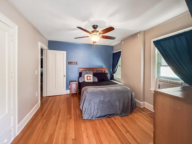 1402 W Lincoln Blvd, Freeport, IL 61032 - bedroom with wood finished floors, a ceiling fan, and cooling unit