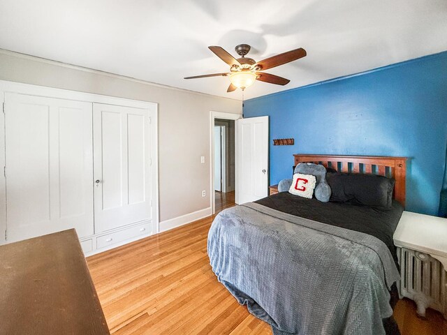 1402 W Lincoln Blvd, Freeport, IL 61032 - bedroom featuring light wood-style flooring, ceiling fan, and a closet