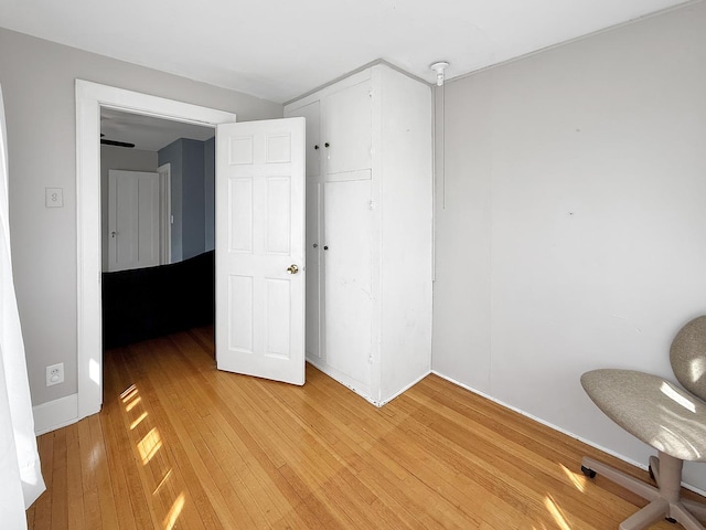 1402 W Lincoln Blvd, Freeport, IL 61032 - unfurnished bedroom with light wood-style flooring and baseboards
