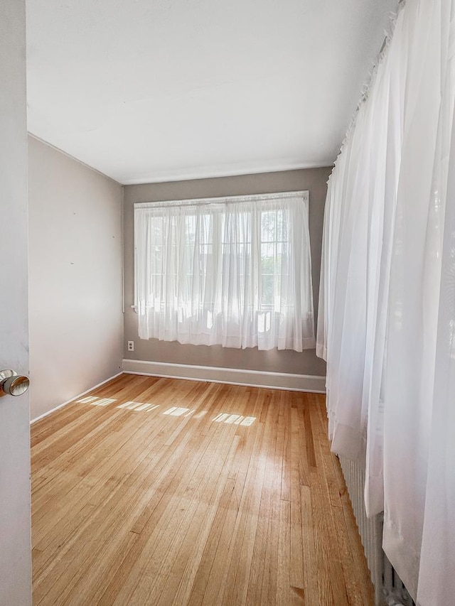1402 W Lincoln Blvd, Freeport, IL 61032 - empty room with light wood finished floors