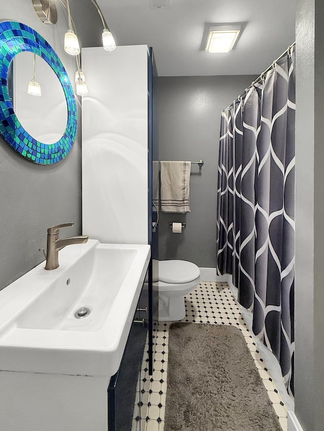 1402 W Lincoln Blvd, Freeport, IL 61032 - full bathroom featuring vanity, tile patterned floors, and curtained shower