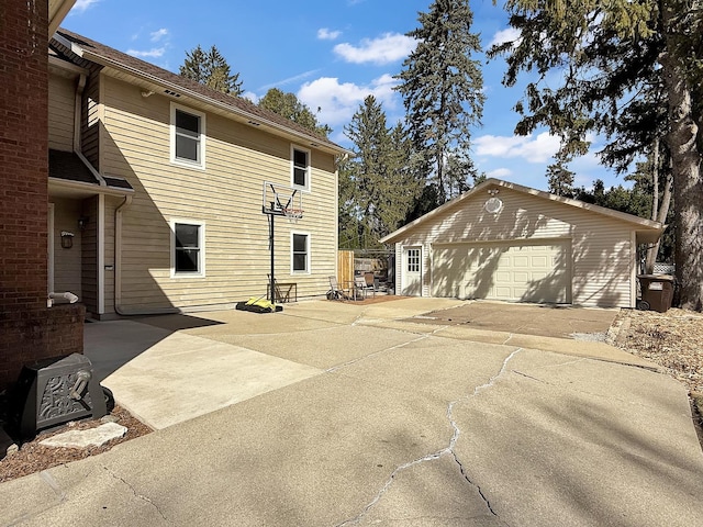 1402 W Lincoln Blvd, Freeport, IL 61032 - rear view of house with an outdoor structure and a garage