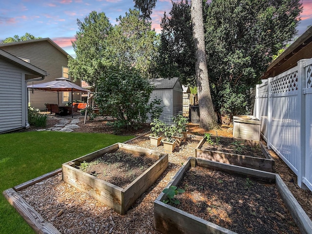 1402 W Lincoln Blvd, Freeport, IL 61032 - view of yard featuring a gazebo, a vegetable garden, a shed, and a patio
