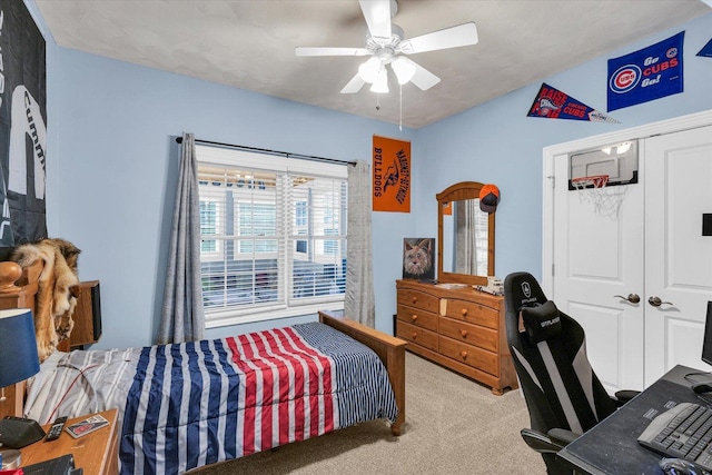 bedroom with carpet floors, ceiling fan, and a closet