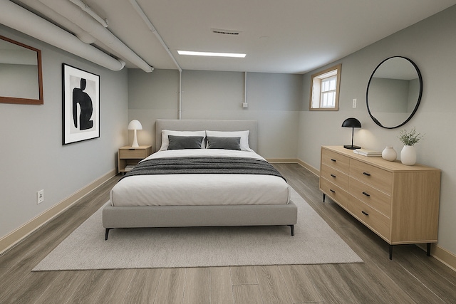 3114 N Long Ave, Chicago, IL 60641 - bedroom featuring dark wood-type flooring, baseboards, and visible vents