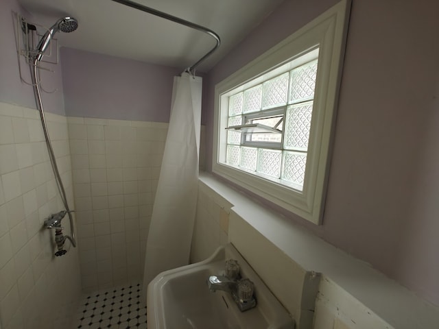 3114 N Long Ave, Chicago, IL 60641 - bathroom with a sink, tile walls, and a shower stall