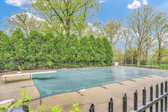 view of pool featuring a patio, fence, and a fenced in pool