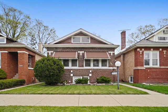 bungalow-style house featuring a front lawn and brick siding