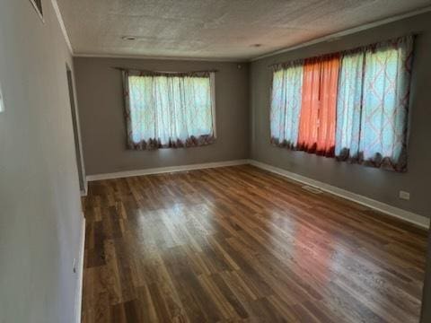 481 Talala St, Park Forest, IL 60466 - empty room featuring healthy amount of natural light, wood finished floors, baseboards, and crown molding