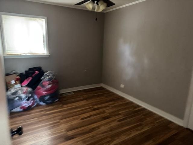 481 Talala St, Park Forest, IL 60466 - empty room featuring crown molding, dark wood finished floors, a ceiling fan, and baseboards