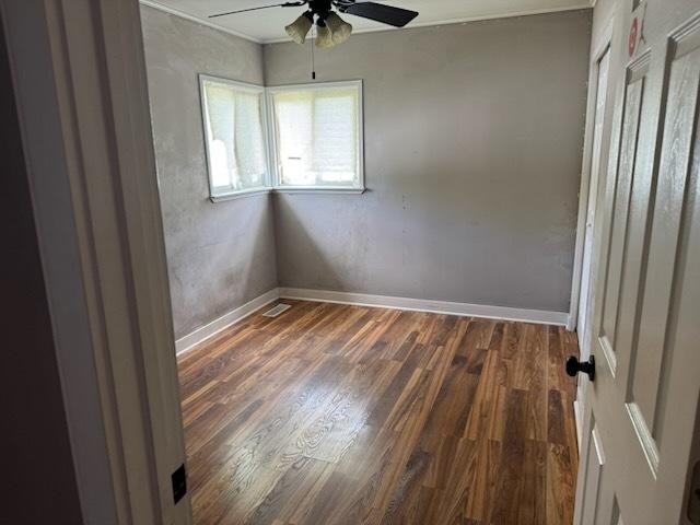 481 Talala St, Park Forest, IL 60466 - empty room with ceiling fan, wood finished floors, baseboards, and crown molding