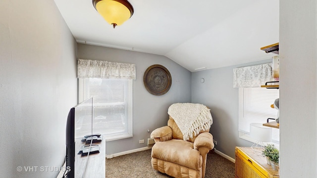 living area with carpet floors, baseboards, and vaulted ceiling