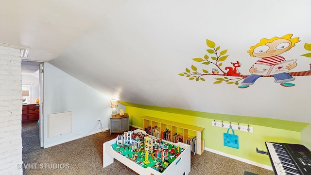 playroom featuring baseboards, carpet, and lofted ceiling