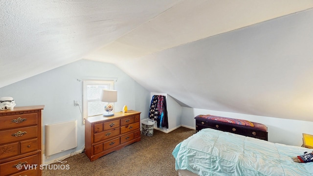 bedroom featuring carpet and vaulted ceiling