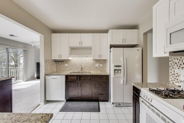1608 Pennsbury Ct Unit A2, Wheeling, IL 60090 - kitchen with white appliances, a sink, backsplash, and white cabinets
