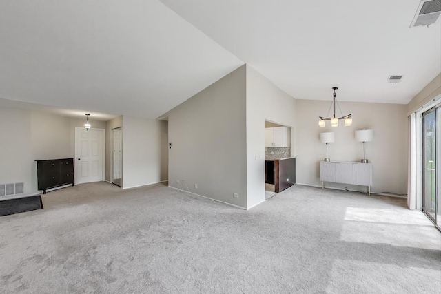 1608 Pennsbury Ct Unit A2, Wheeling, IL 60090 - unfurnished living room with light colored carpet, a chandelier, and baseboards