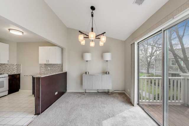 1608 Pennsbury Ct Unit A2, Wheeling, IL 60090 - dining area featuring vaulted ceiling and a chandelier