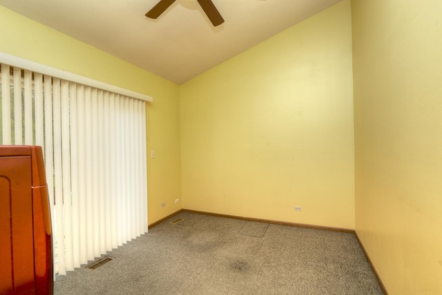 unfurnished room with carpet flooring, a ceiling fan, baseboards, lofted ceiling, and visible vents