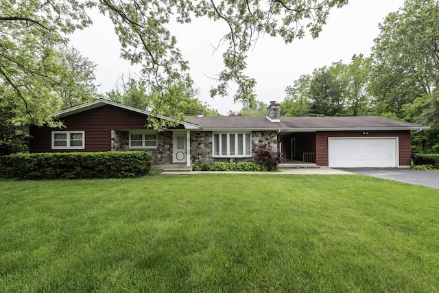 301 Garnett Ave, Winthrop Harbor, IL 60096 - ranch-style house with a chimney, driveway, an attached garage, and a front lawn