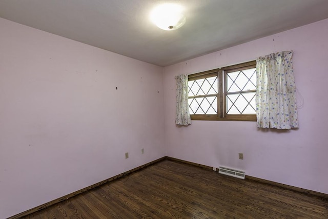 301 Garnett Ave, Winthrop Harbor, IL 60096 - empty room with dark wood finished floors and baseboards