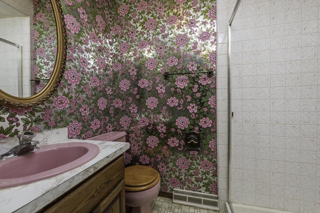 301 Garnett Ave, Winthrop Harbor, IL 60096 - full bath with wallpapered walls, toilet, a stall shower, vanity, and baseboards