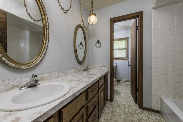 301 Garnett Ave, Winthrop Harbor, IL 60096 - full bathroom featuring toilet, double vanity, and tile patterned flooring