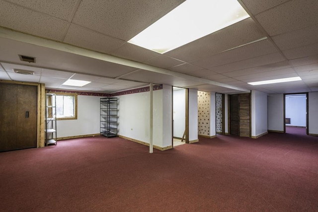 301 Garnett Ave, Winthrop Harbor, IL 60096 - below grade area with carpet floors, a drop ceiling, and baseboards