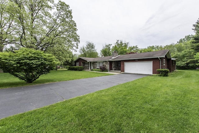 301 Garnett Ave, Winthrop Harbor, IL 60096 - view of front of house featuring a garage, a chimney, a front lawn, and asphalt driveway