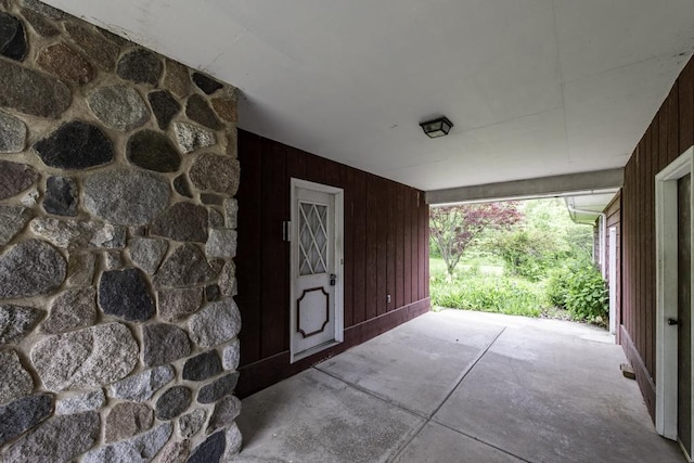 301 Garnett Ave, Winthrop Harbor, IL 60096 - doorway to property featuring stone siding and a patio area