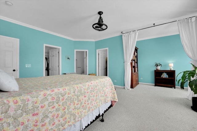 bedroom featuring baseboards, ornamental molding, and carpet
