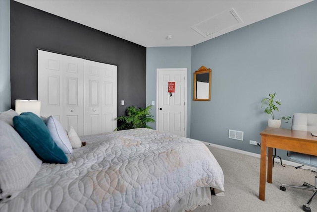 carpeted bedroom featuring visible vents, attic access, baseboards, and a closet