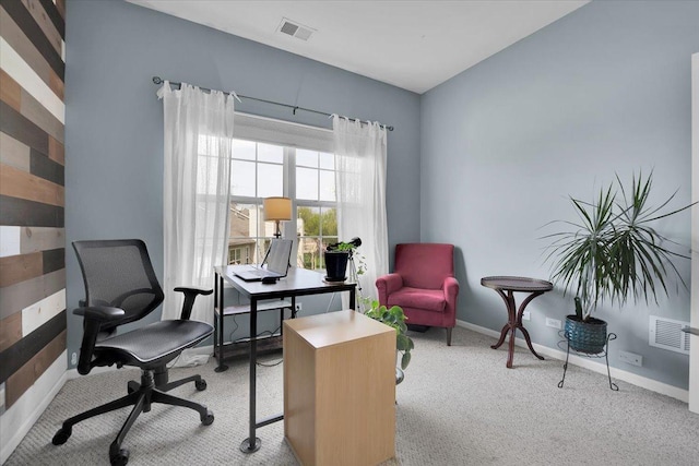 carpeted home office featuring baseboards and visible vents