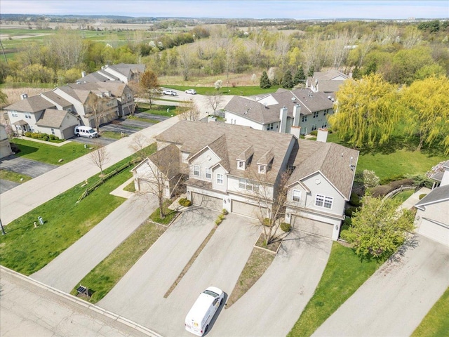 birds eye view of property with a residential view