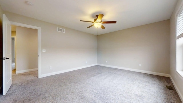 1406 Myrtle Beach Ave, Champaign, IL 61822 - empty room featuring a ceiling fan, carpet flooring, and a smoke detector
