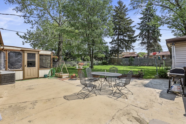 11341 S Nagle Ave, Worth, IL 60482 - view of patio / terrace featuring outdoor dining space, a grill, cooling unit, and a sunroom