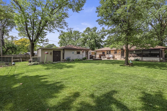 11341 S Nagle Ave, Worth, IL 60482 - view of yard featuring an outbuilding and a sunroom