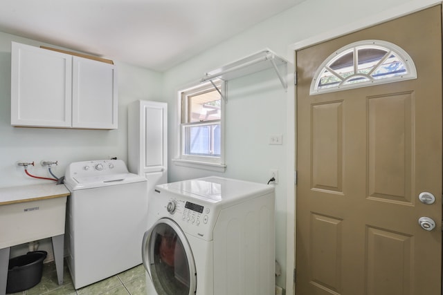 11341 S Nagle Ave, Worth, IL 60482 - laundry area featuring separate washer and dryer, cabinet space, and light tile patterned floors
