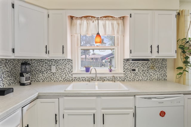 11341 S Nagle Ave, Worth, IL 60482 - kitchen with white dishwasher, a sink, white cabinets, and light countertops