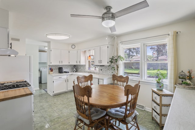 11341 S Nagle Ave, Worth, IL 60482 - dining space with light tile patterned flooring, a ceiling fan, and washer / dryer