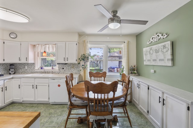 11341 S Nagle Ave, Worth, IL 60482 - kitchen with white dishwasher, a sink, decorative backsplash, and a ceiling fan