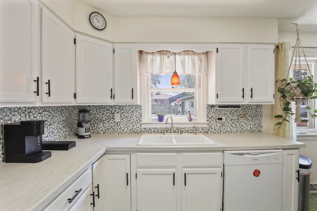 11341 S Nagle Ave, Worth, IL 60482 - kitchen featuring white dishwasher, a sink, white cabinets, and decorative backsplash