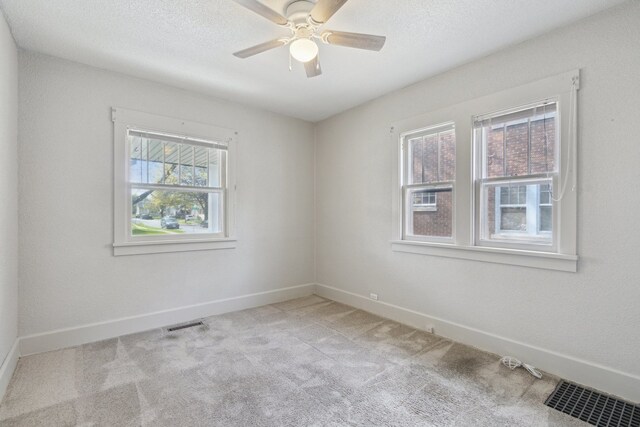 2228 8th St, Rockford, IL 61104 - empty room featuring visible vents, carpet, ceiling fan, and baseboards