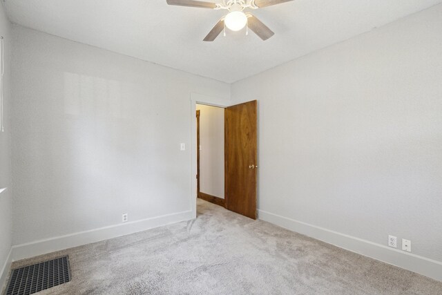 2228 8th St, Rockford, IL 61104 - unfurnished room with carpet flooring, a ceiling fan, baseboards, and visible vents