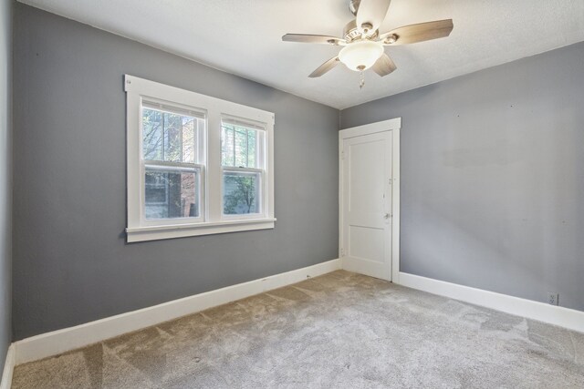 2228 8th St, Rockford, IL 61104 - carpeted empty room featuring baseboards and ceiling fan