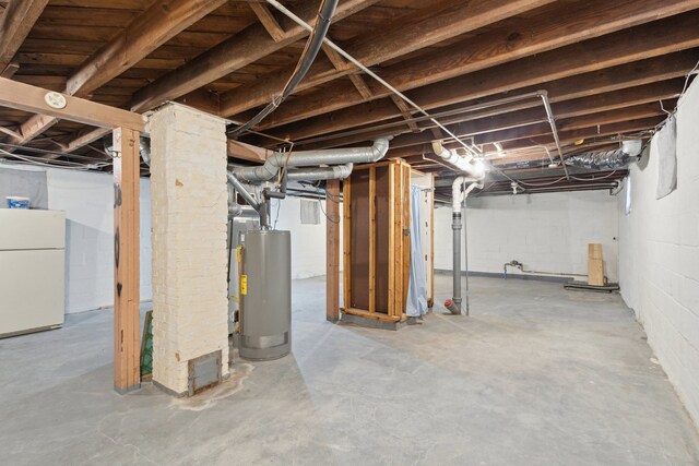 2228 8th St, Rockford, IL 61104 - unfinished basement featuring freestanding refrigerator and water heater