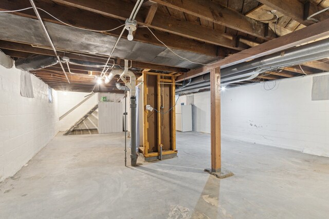 2228 8th St, Rockford, IL 61104 - unfinished basement featuring freestanding refrigerator